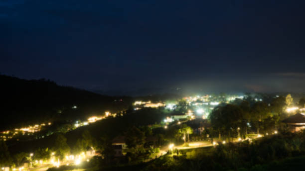 istock Blur Villages and mountains at night background 1049694286