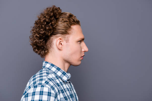 istock Profile side view portrait of minded stylish good-looking nice handsome attractive content guy with wavy hair in casual checkered shirt. Isolated over grey background 1049704608