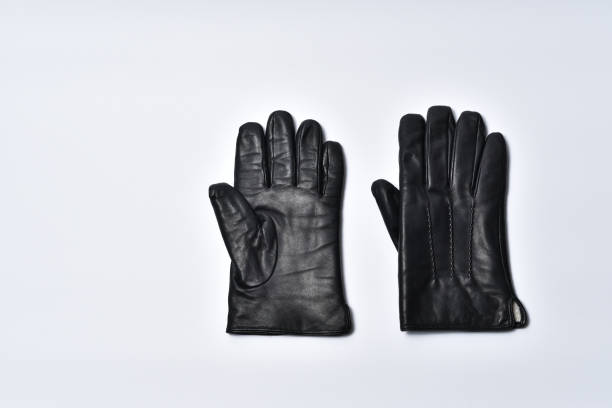 istock Black men's gloves on a white background 1049707732