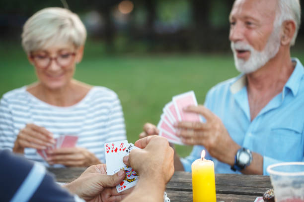 istock Senior people playing cards game 1049709716