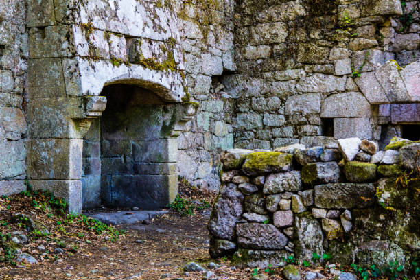 istock Old living room with fireplace in ruins 1049711220
