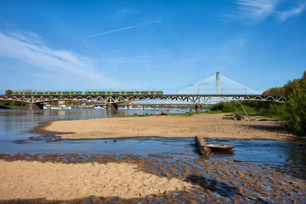 Poland, city of Warsaw, Vistula River with sand beach and bridges, wild right shore.
