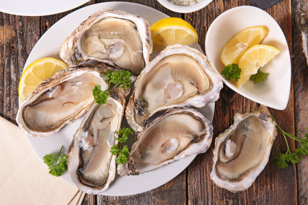 istock opened oyster and lemon 1049717916
