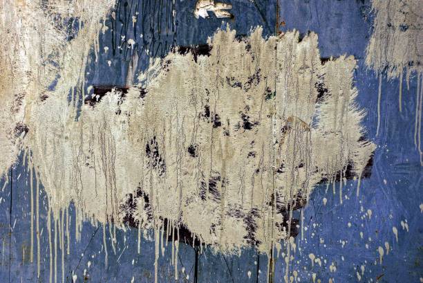 istock old dirty wall with a stain of white paint 1049718410