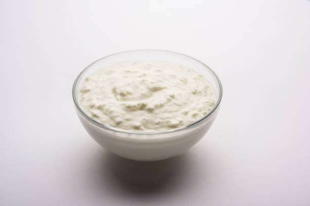 istock Plain curd or yogurt or Dahi in Hindi, served in a bowl over moody background. Selective focus 1049718606