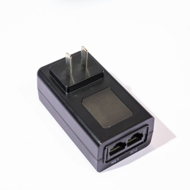 spina caricabatterie - plug adapter charging mobile phone battery charger foto e immagini stock