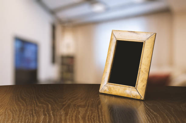 istock old photo frame on the wooden table 1049721790