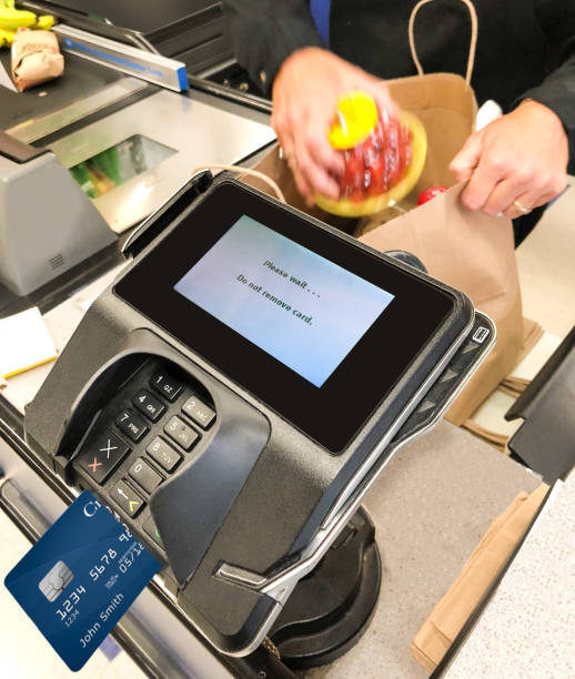 istock Credit card reader payment terminal in grocery store 1049721864