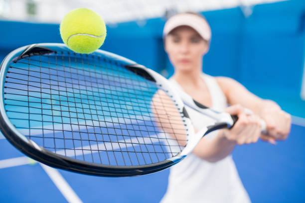 istock Woman Playing Tennis 1049728312