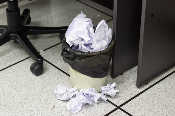 istock White paper balls into trash in work office 1049728338