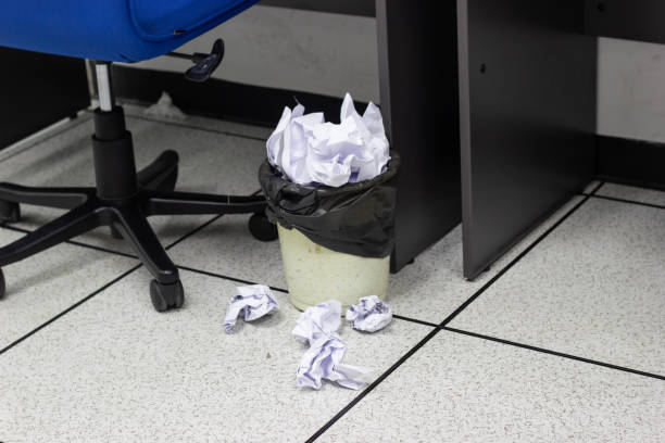 White paper balls into trash in work office, concept office life