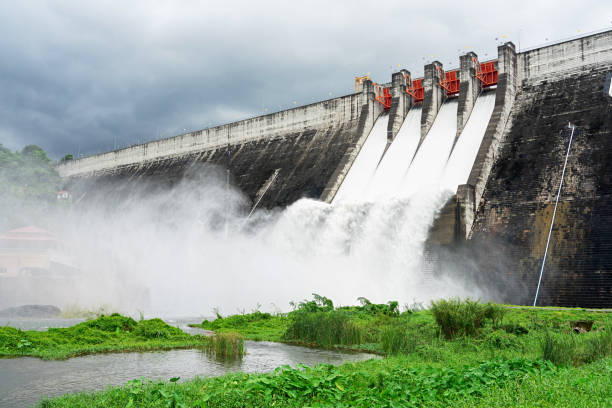 istock Concrete dam with streaming water from spillways 1049728508
