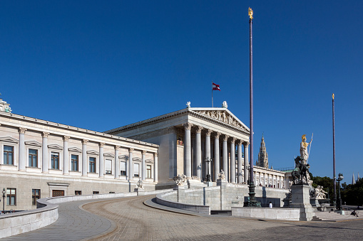 Parliament Buildings on Ringstrabe in Vienna, Austria. The Austrian Parliament is the bicameral legislature of Austria. It consists of two chambers: the National Council (Nationalrat) and the Federal Council.