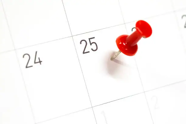 25th Important day on calendar with selective focus with red pin