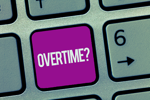 Text sign showing Overtime question. Conceptual photo Time worked in addition to regular working hours.