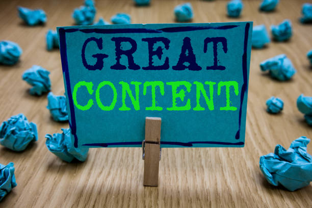 istock Handwriting text writing Great Content. Concept meaning Satisfaction Motivational Readable Applicable Originality Clothespin holding blue paper note crumpled papers several tries mistakes. 1049735900