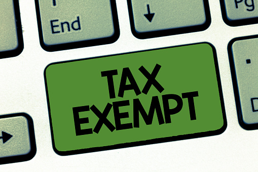 Muestra de texto mostrando exentas de impuestos. Foto conceptual ingresos o transacciones libres de impuestos pagan reducción photo