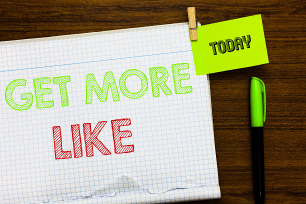 istock Writing note showing Get More Like. Business photo showcasing Thumbs up Hashtags Page Plugin Approvals Followers Open notebook page markers holding paper heart wooden background. 1049735976