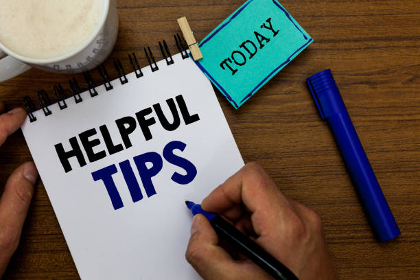 istock Writing note showing Helpful Tip s is. Business photo showcasing Ask an Expert Solutions Hints Consulting Warning Man holding marker notebook clothespin reminder wooden table coffee. 1049737780
