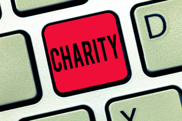 istock Handwriting text writing Charity. Concept meaning Organization provide help Raise money for support showing in need 1049737820