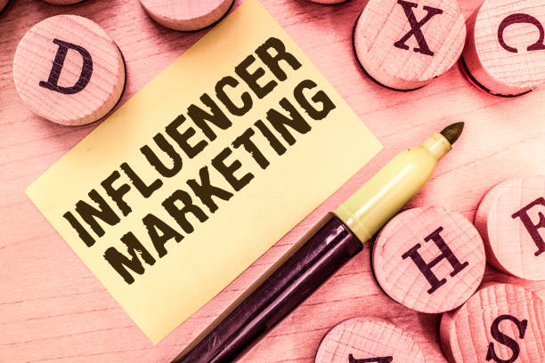 istock Handwriting text writing Influencer Marketing. Concept meaning Endorser who Influence Potential Target Customers 1049737942