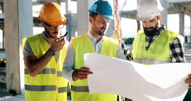 istock Portrait of construction engineers working on building site 1049742274