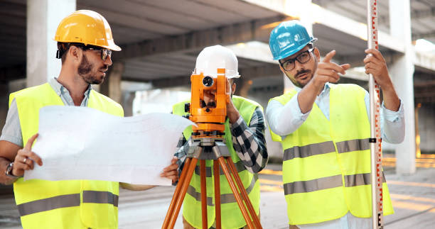 istock Team of architects people in group on construciton site 1049742342