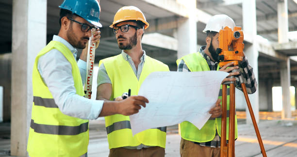istock Team of architects people in group on construciton site 1049742354