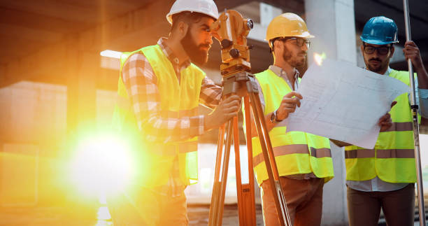 istock Team of construction engineers working on building site 1049742378