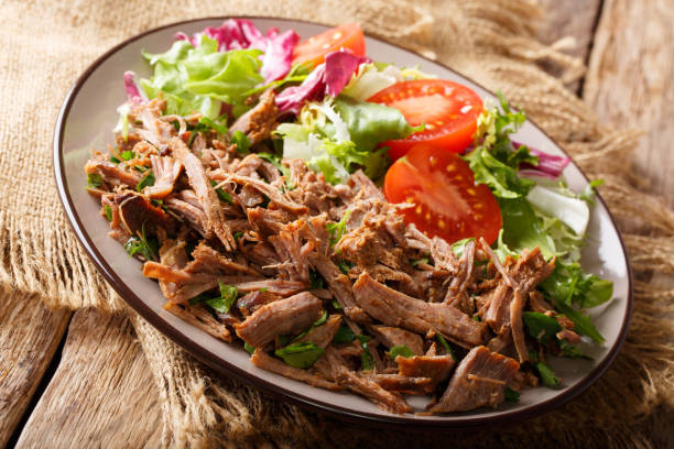 istock Healthy lunch: tender beef with vegetable salad close-up on a plate. horizontal 1049743096