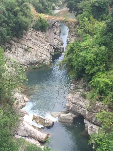 istock Medieval bridge on the river Calore, Felitto, Cilento, italy. 1049750554