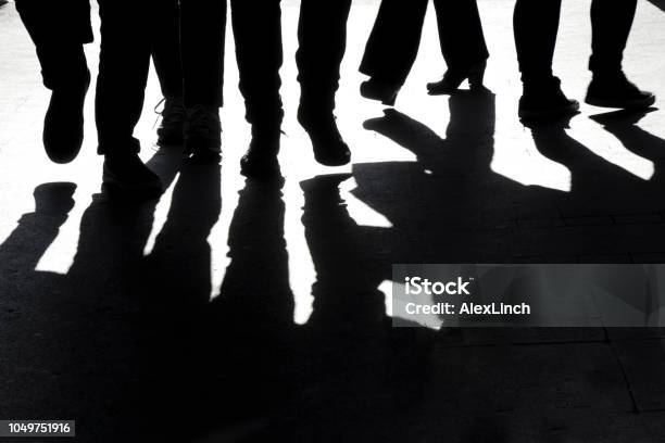 Blurry High Contrast Silhouettes And Shadows Of Legs Stock Photo - Download Image Now