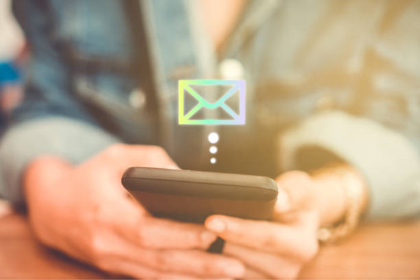 istock Woman hand using smartphone to send and recieve email. Business communication technology concept. 1049765028