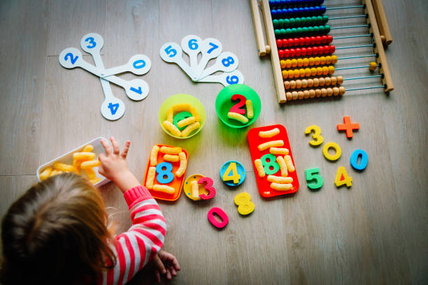 istock little girl learning numbers and math at home 1049768462