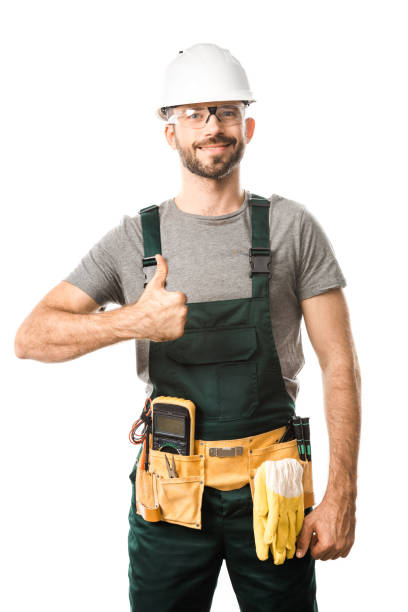smiling handsome electrician showing thumb up isolated on white smiling handsome electrician showing thumb up isolated on white electrician smiling stock pictures, royalty-free photos & images