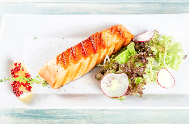 istock Grilled salmon with lettuce, redish and lemon 1049772392