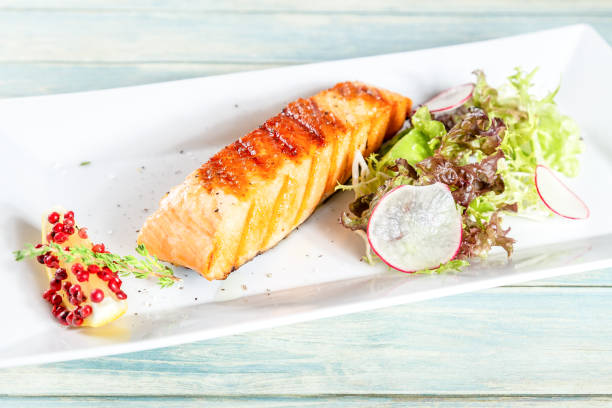 istock Grilled salmon with lettuce, redish and lemon 1049774590