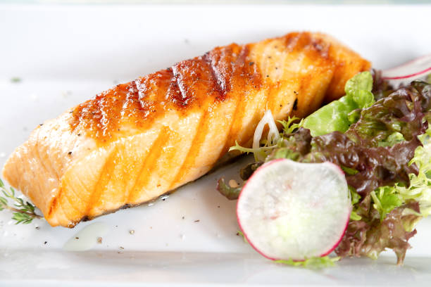 istock Grilled salmon with lettuce, redish and lemon 1049774658