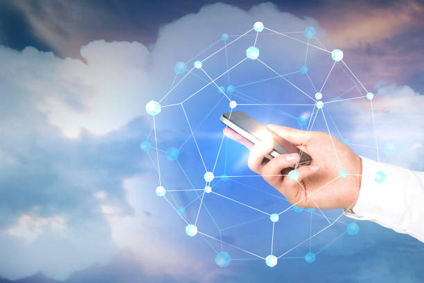 istock Man hand holding smartphone, network in sky 1049774728