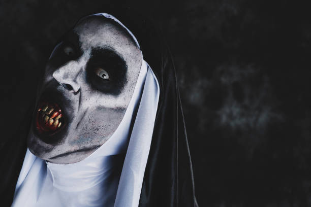 istock frightening evil nun with bloody teeth 1049781256
