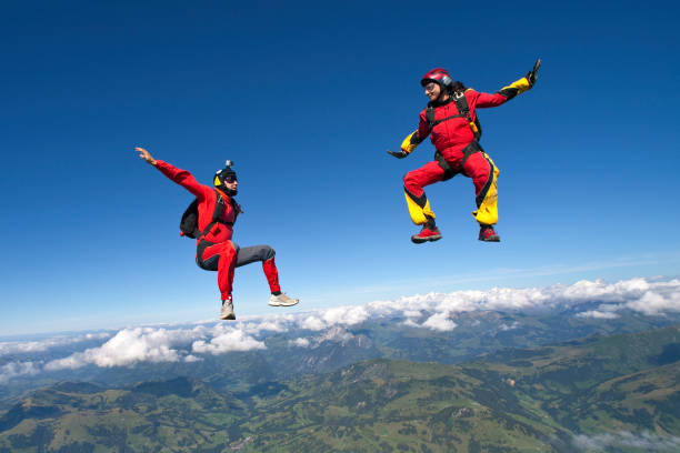 istock Skydivers plunge through lofty skies above mountains 1049791572