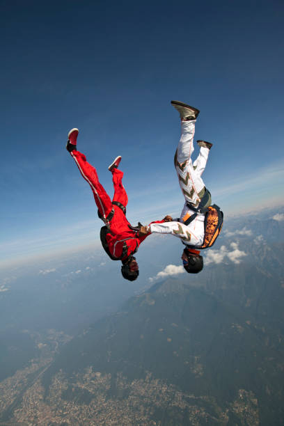 istock Skydivers plunge through lofty skies above rural area 1049791608