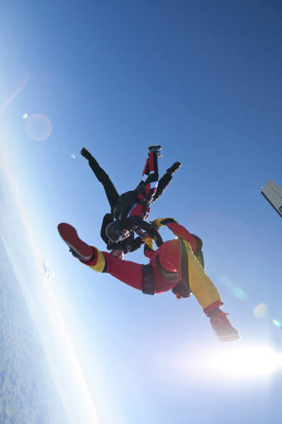 istock Skydivers plunge through lofty skies above rural area 1049791744