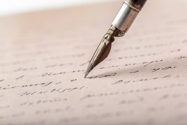 istock Fountain pen on an antique handwritten letter 1049795142