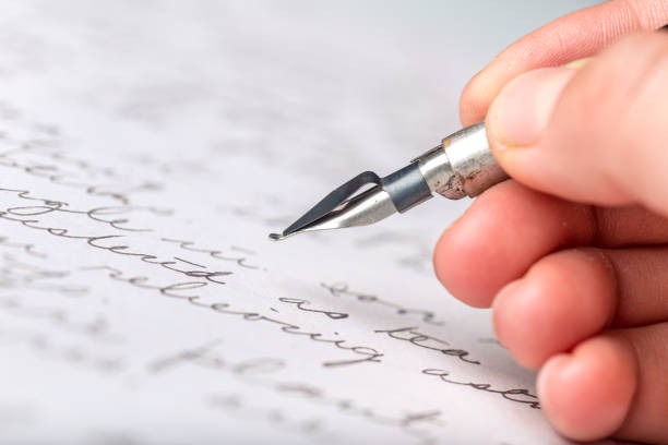 istock Fountain pen on an antique handwritten letter 1049795216