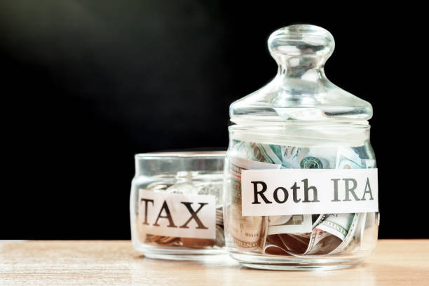 glass jar used for saving US dollar bills and notes for IRA retirement fund