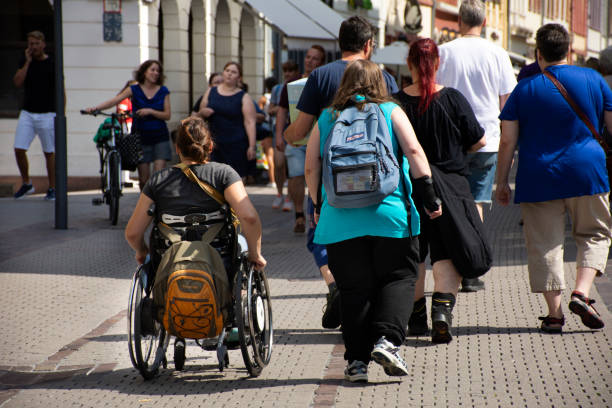 German Disabled people and foreign travelers walking visit and shopping at Heidelberg or Heidelberger old town on August 25, 2017 in Baden-Wurttemberg, Germany