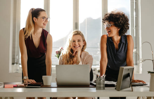 istock Group of three diverse women in office 1049802618