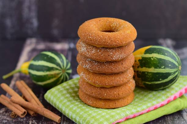 Stack of pumpkin donuts with cinnamon sugar