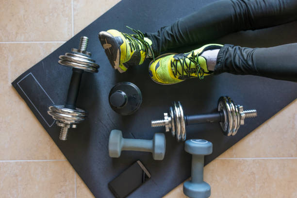 istock Dumbbell and mat training at home, 1049812440